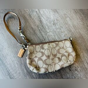 Coach classic brown and cream monogram wristlet wallet. In great condition!
